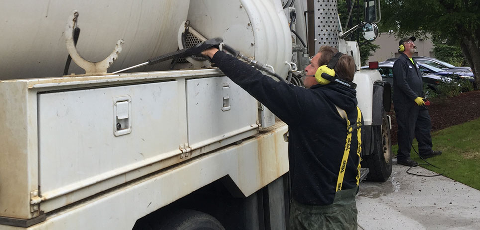 Vactor crew using Sonetics Wireless Headsets for safer work zone communication.