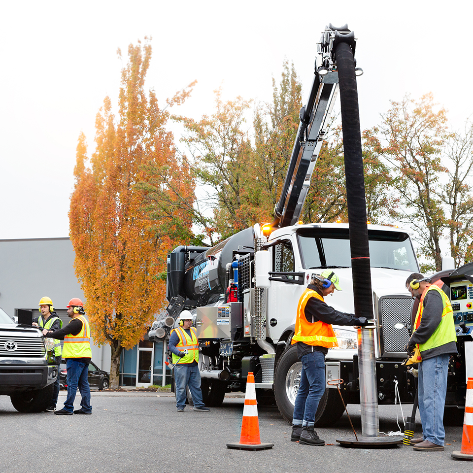 Public Works crew using vacuum truck.