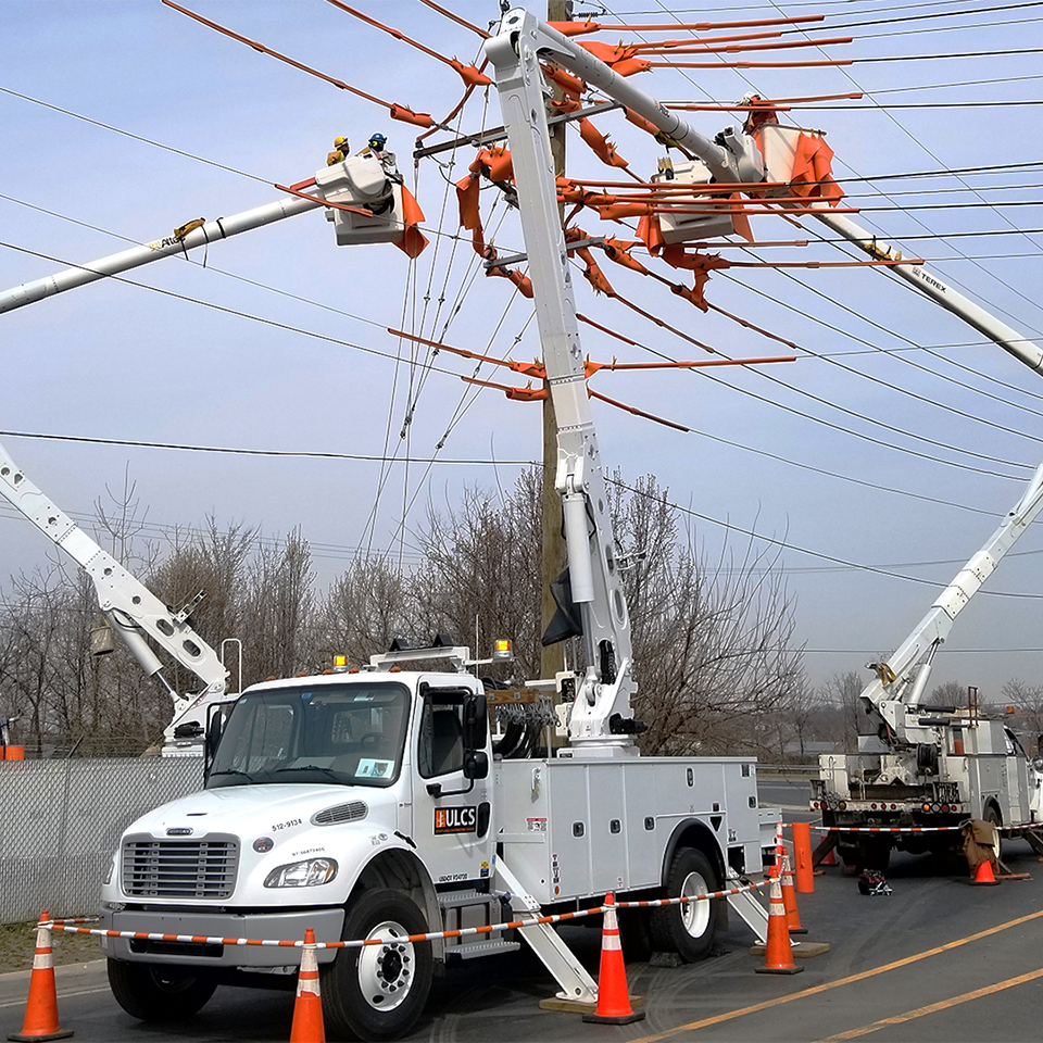 Utility lineman using Apex Team Wireless Headsets.